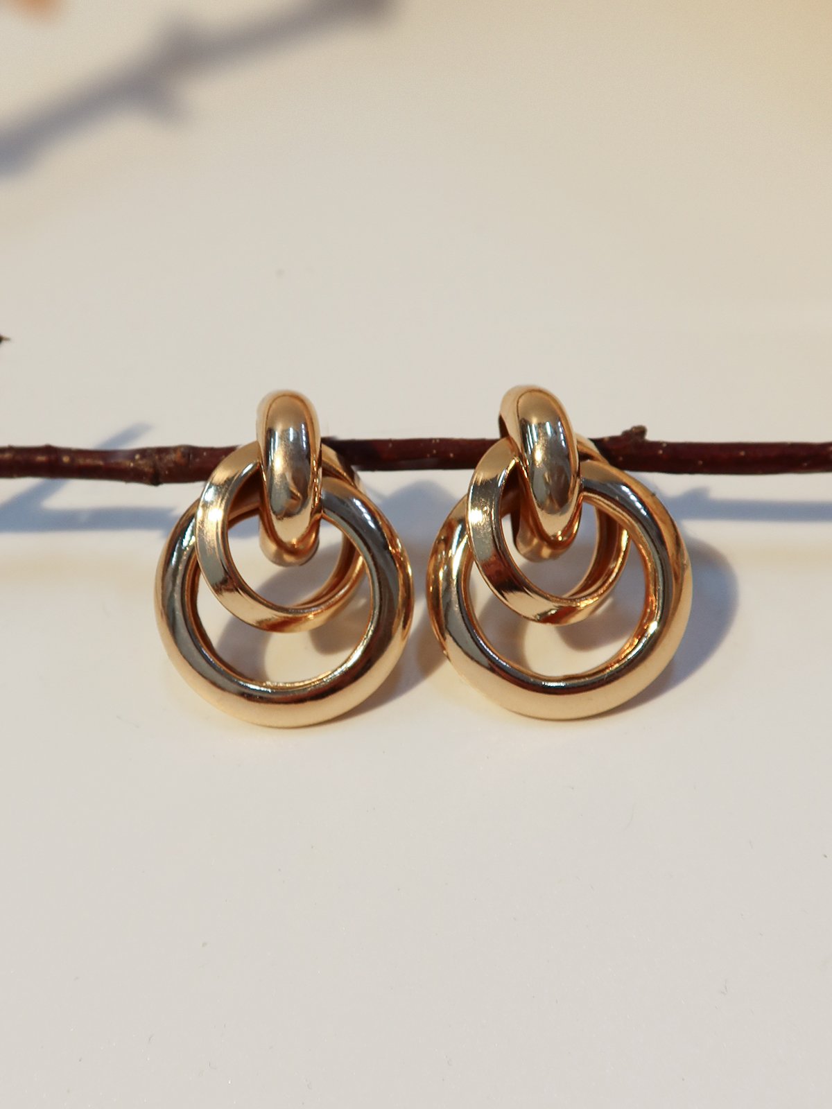 Gold geometric round ear clips