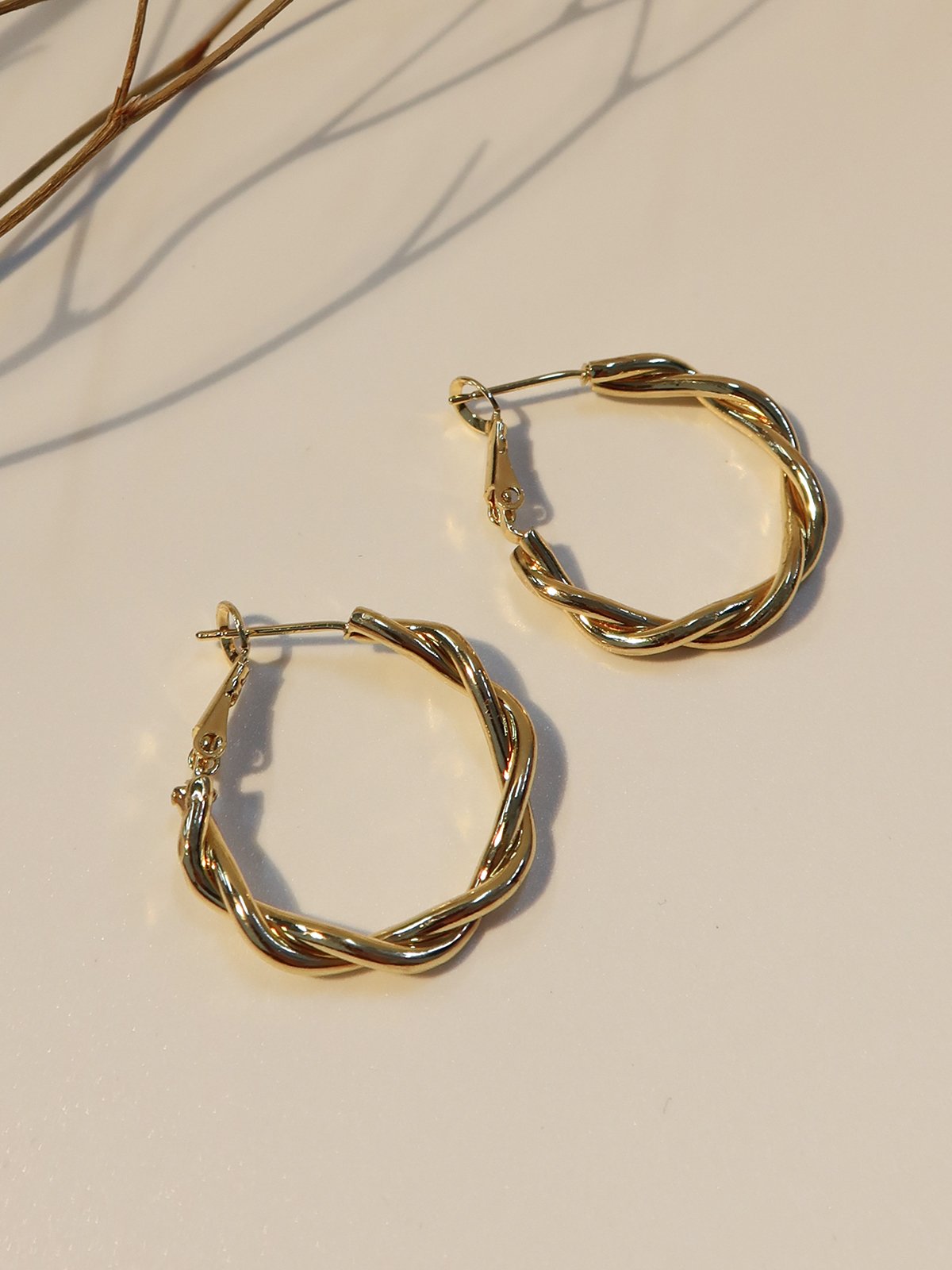 Twist design earrings