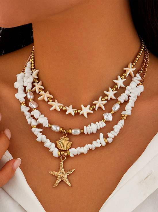 Ocean-Inspired Seashell And Diamond-Encrusted Tassel Necklace With Multi-Cross Pendant.